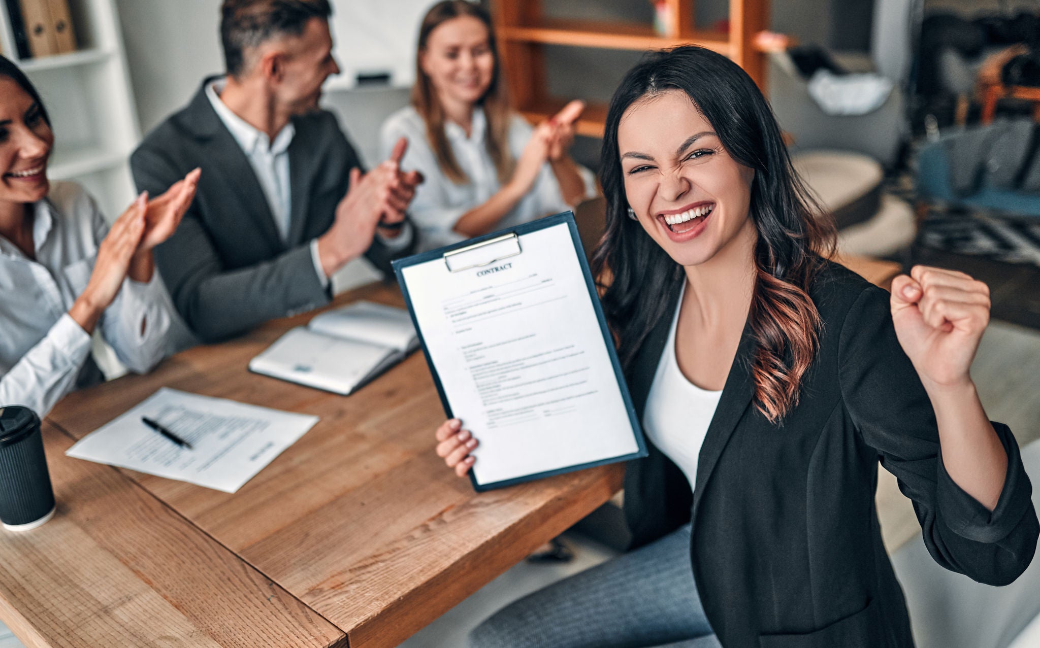 Attractive young woman on job interview  in modern light office