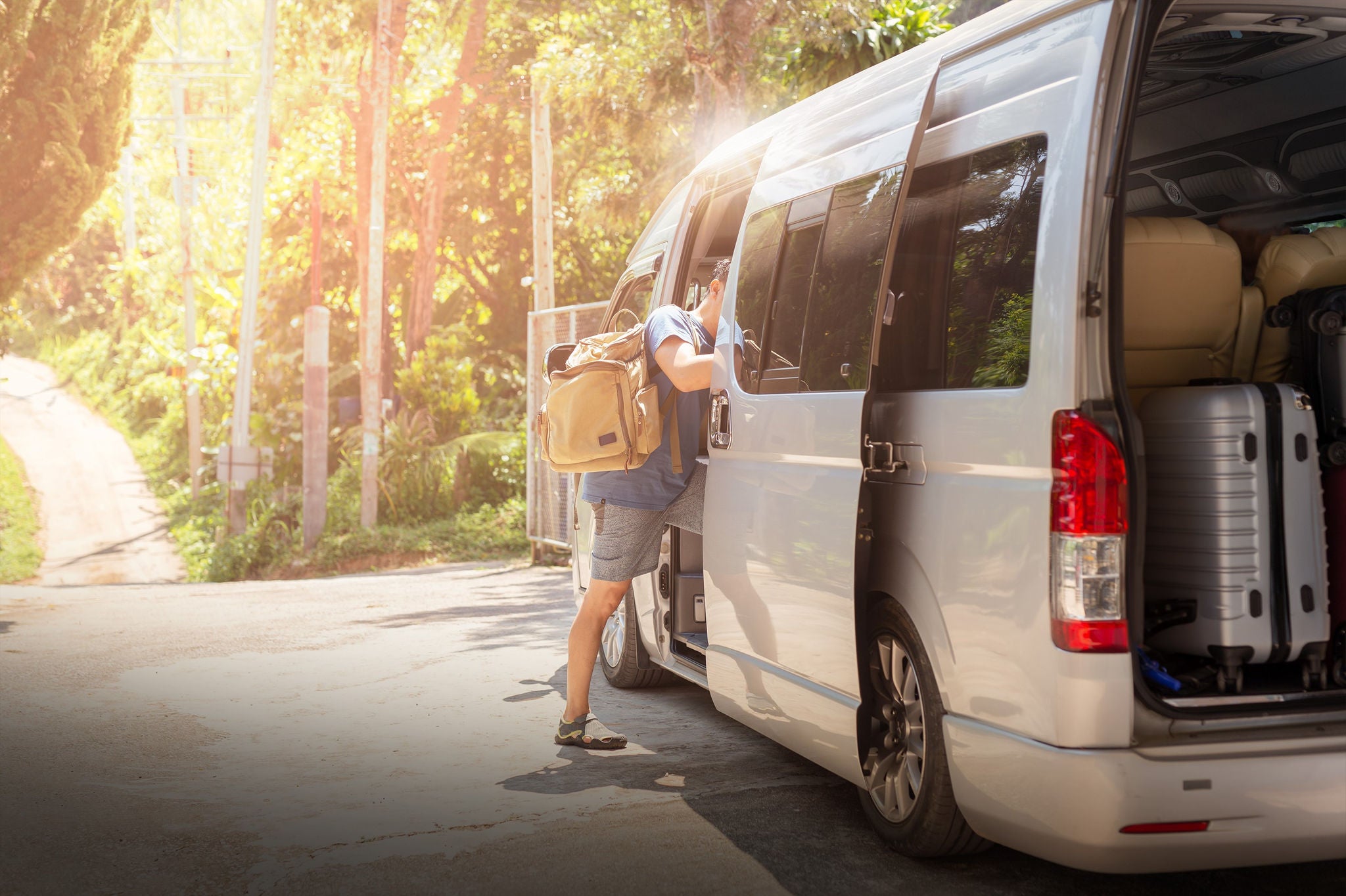 Person getting into minivan with integrated air-conditioning