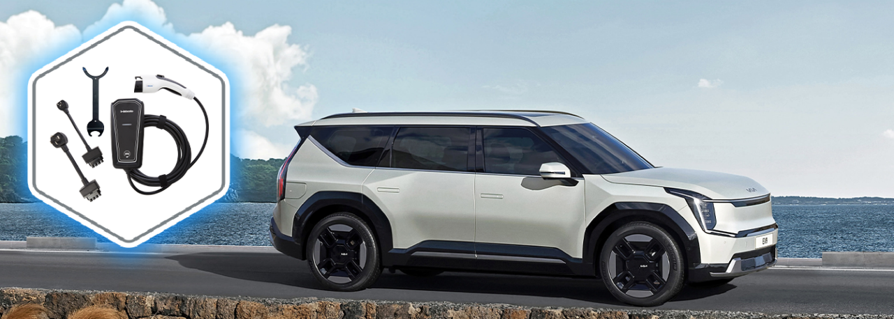 Products & solutions – electrification: Webasto EV charging kit with adapters beside an electric SUV, showcasing system partner charging solutions for cars.
